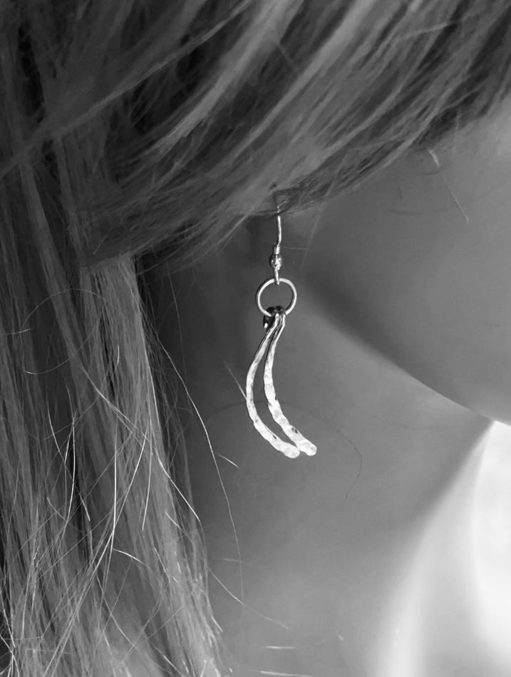 Silver swishy tail drop earrings
