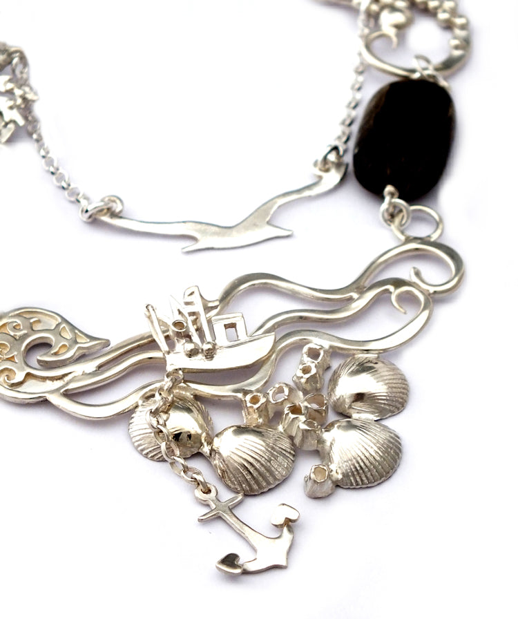 Fishing boat bobbing sea necklace