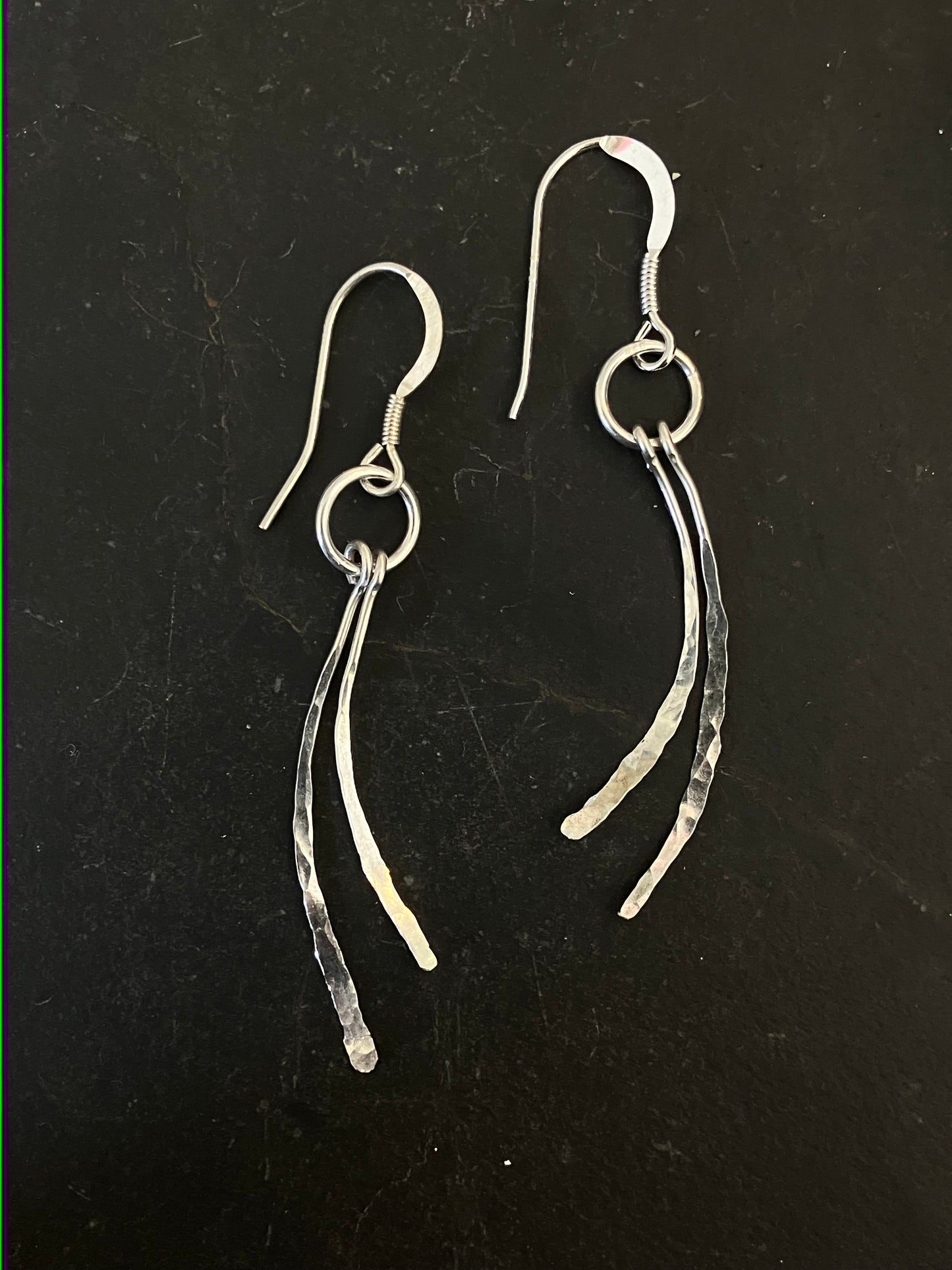Silver swishy tail drop earrings