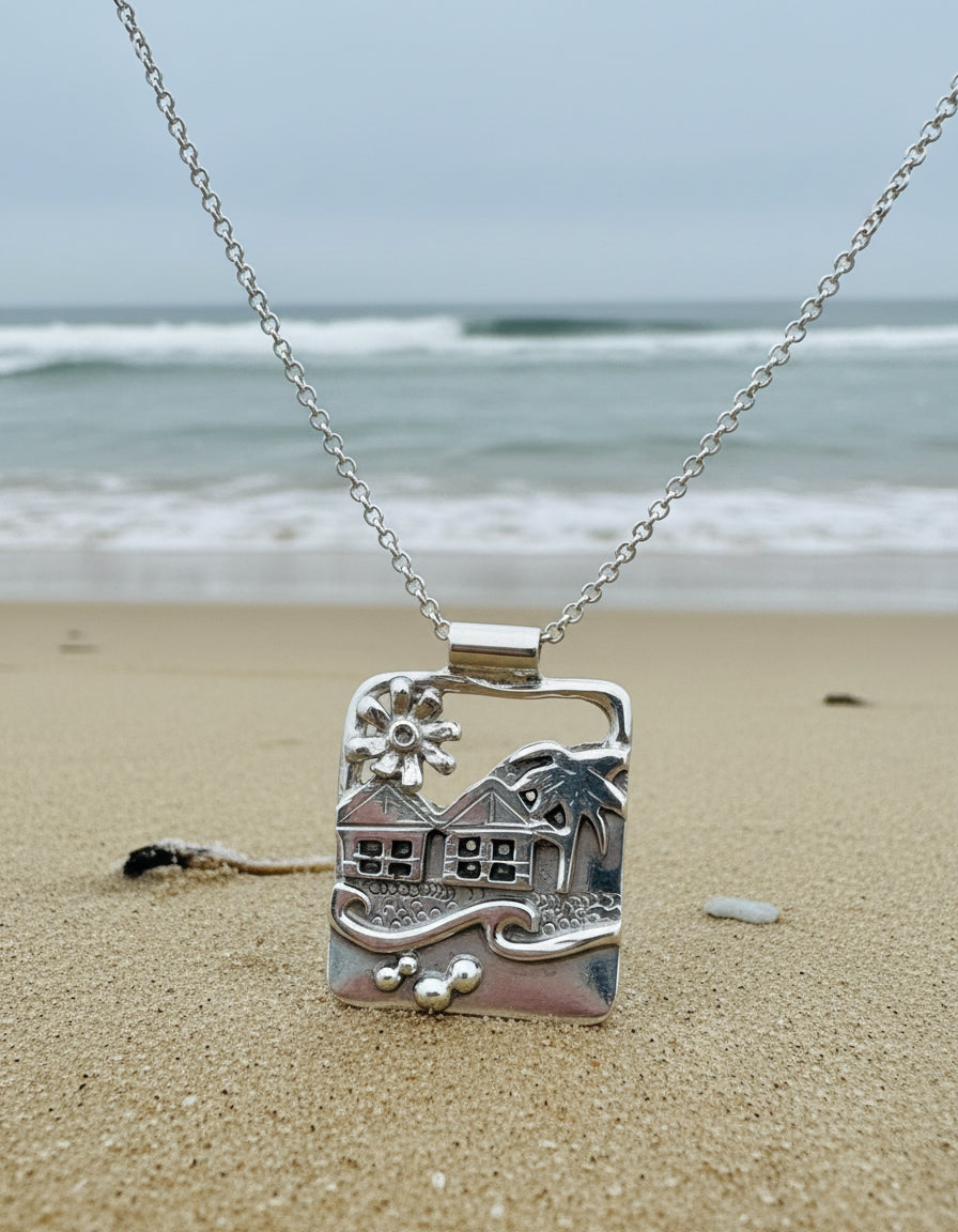 Silver pendant a Langland Bay seascape beach scene with flower huts and waves in solid silver
