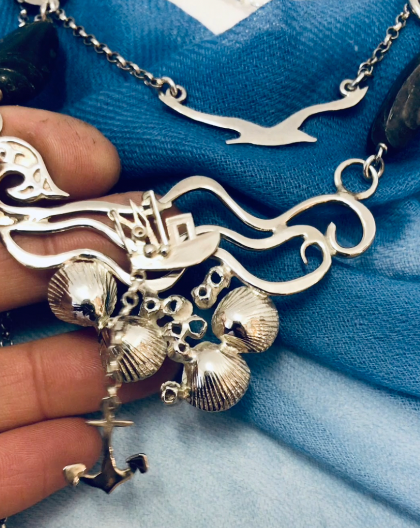 Fishing boat bobbing sea necklace