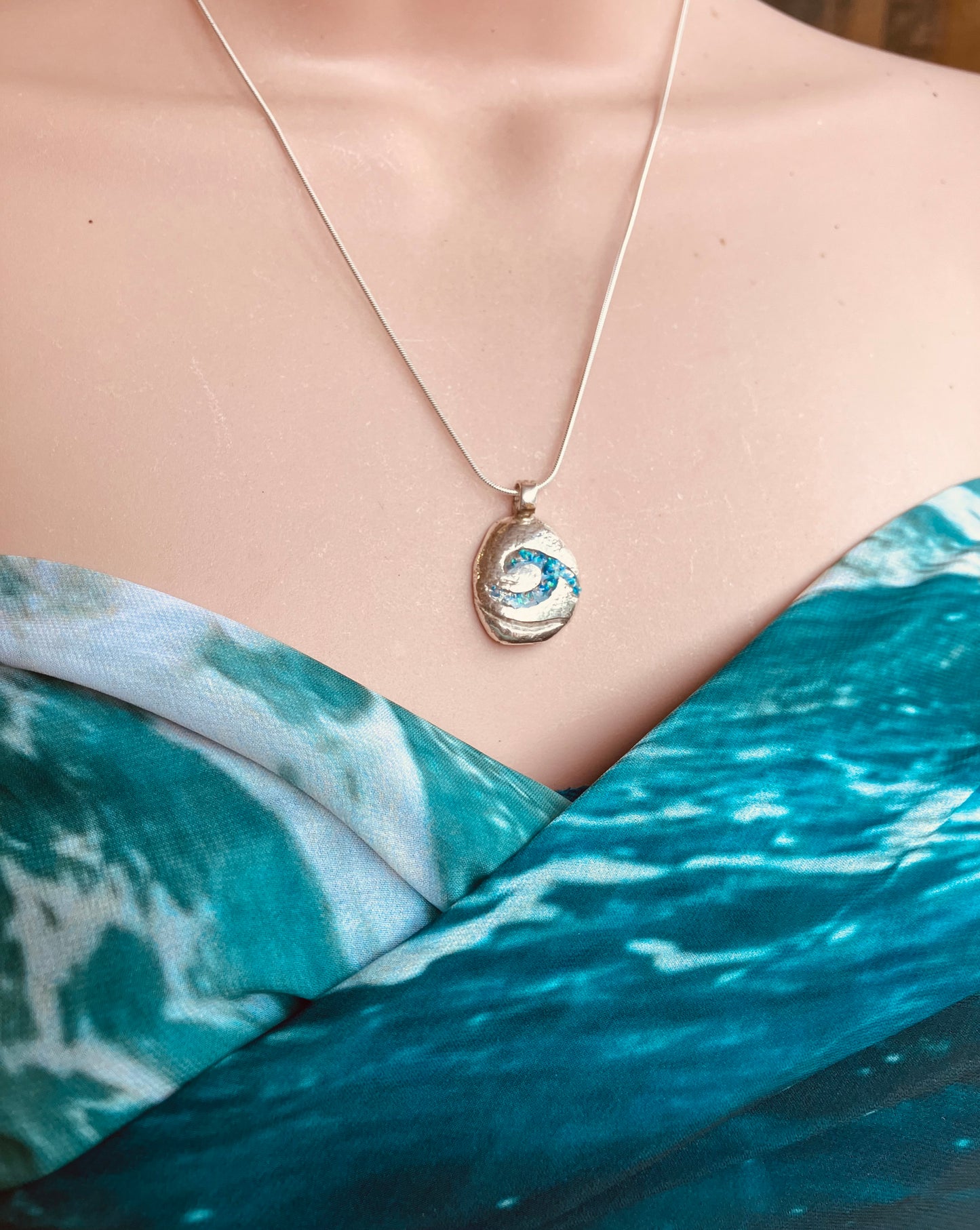 Silver pebble necklace with resin opal wave inlay
