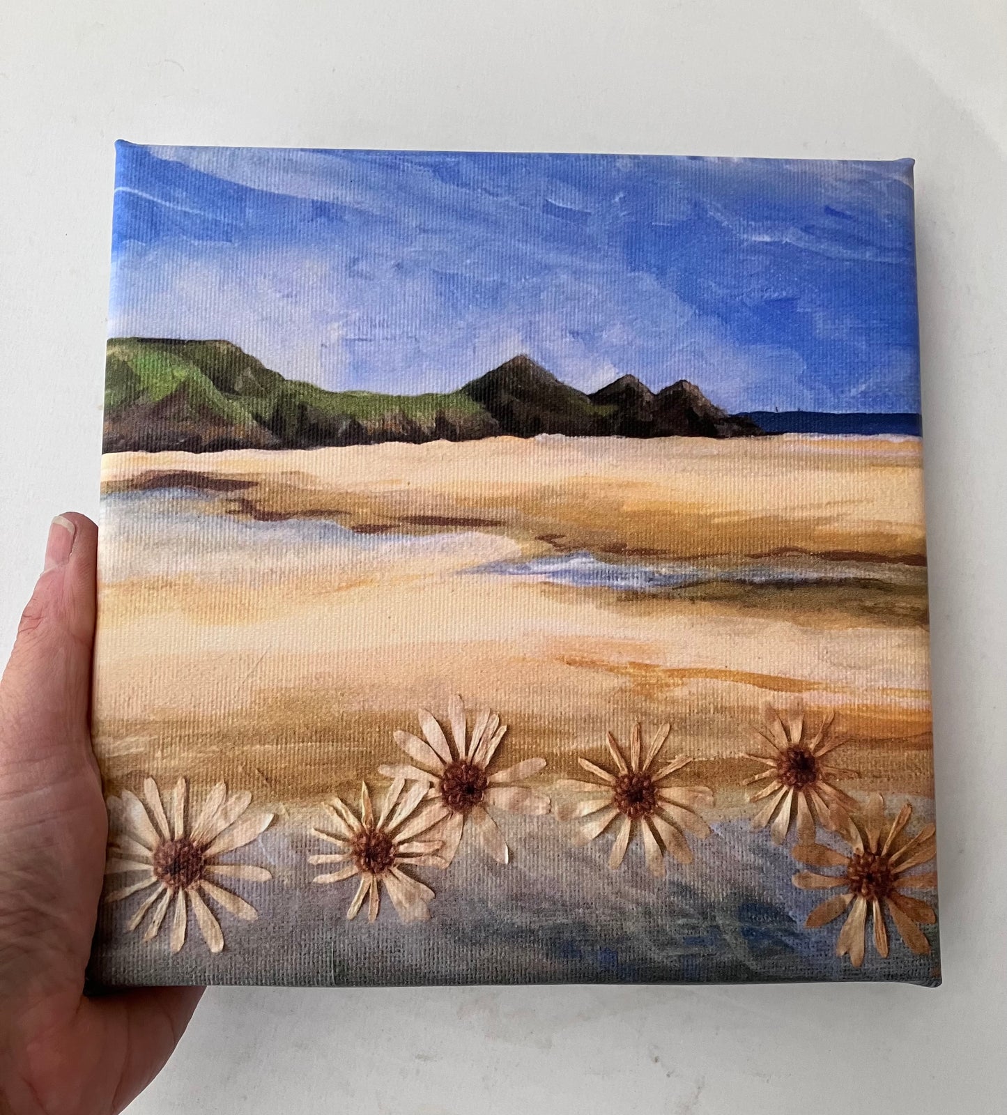 Three Cliffs Bay painting with daises