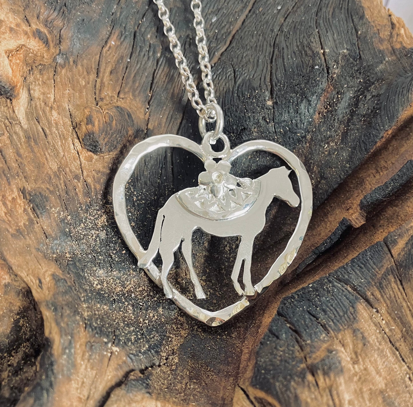 horse in a silver heart necklace