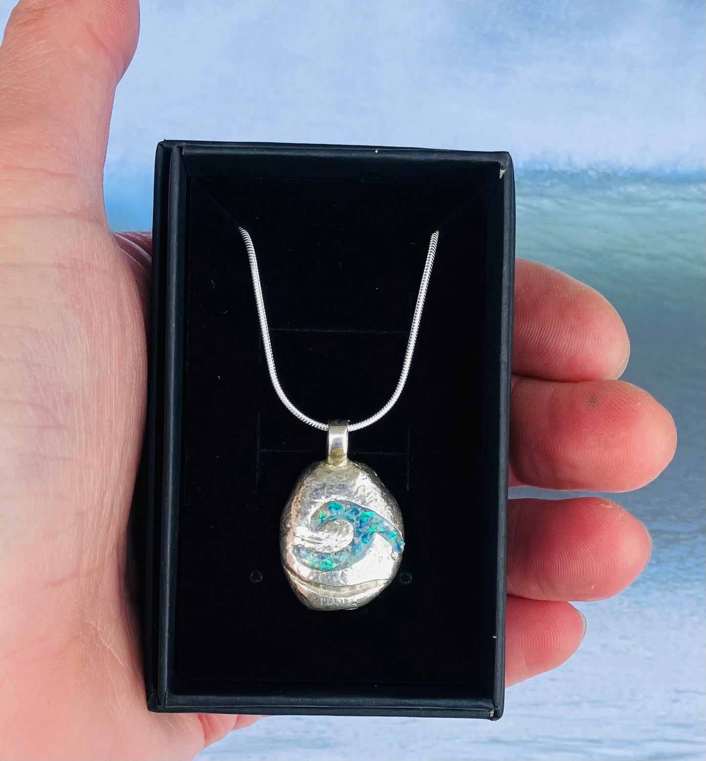 Silver pebble necklace with resin opal wave inlay