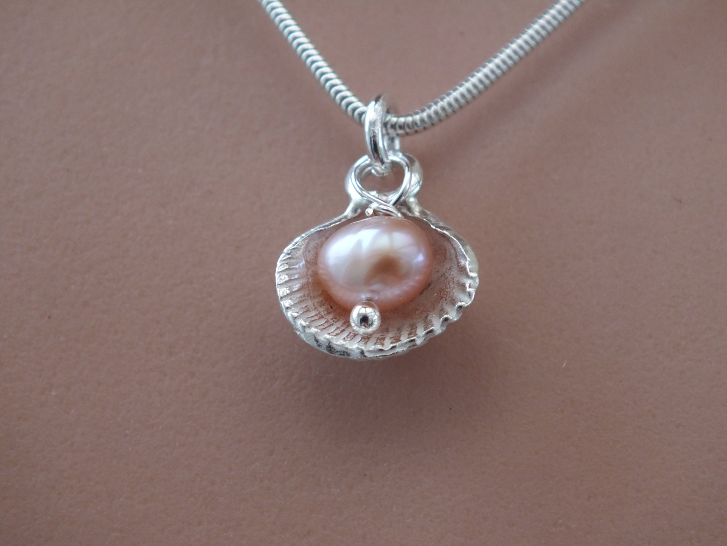 cockle shell solid silver necklace with pearl earl inside necklace