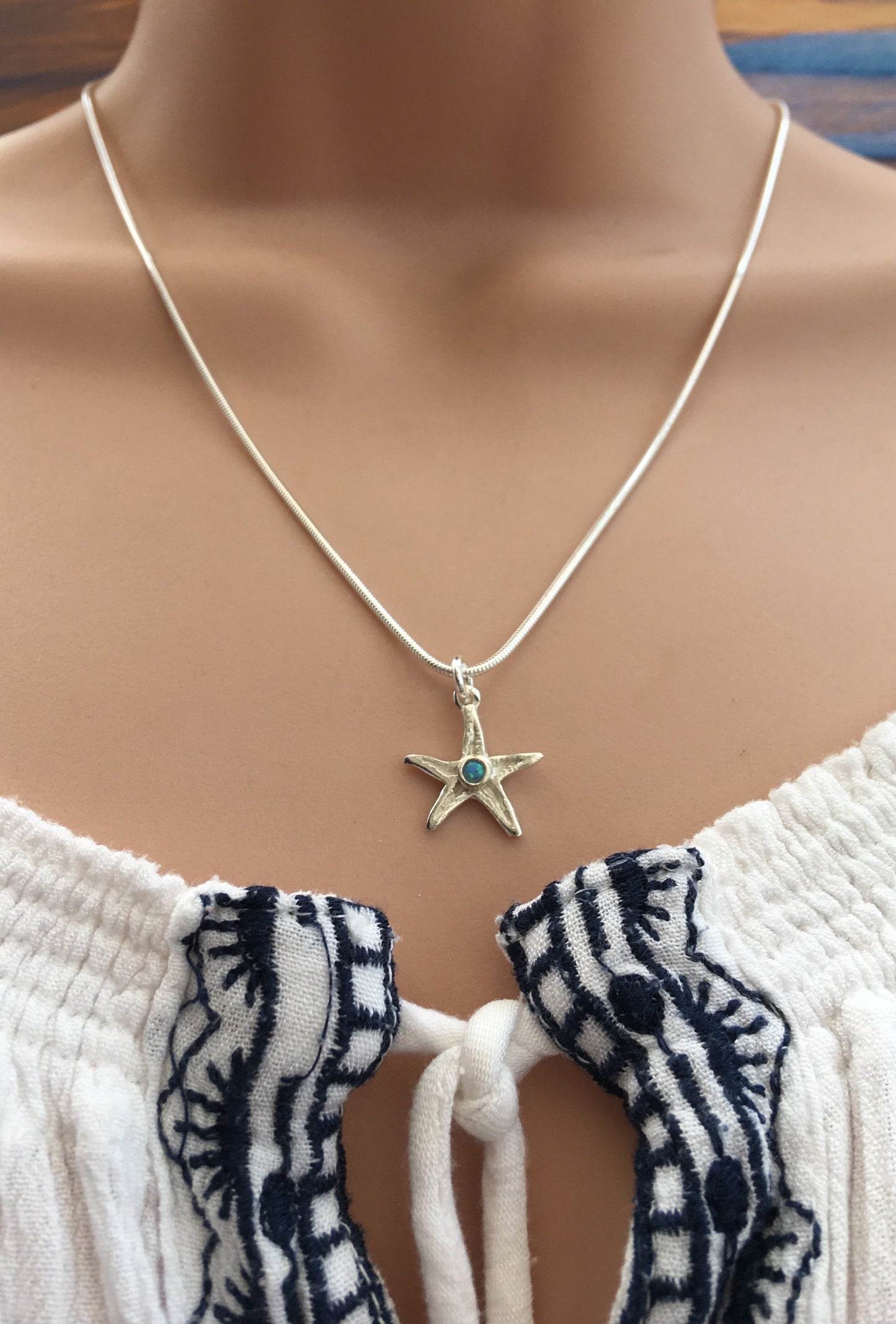 Silver starfish necklace with opal