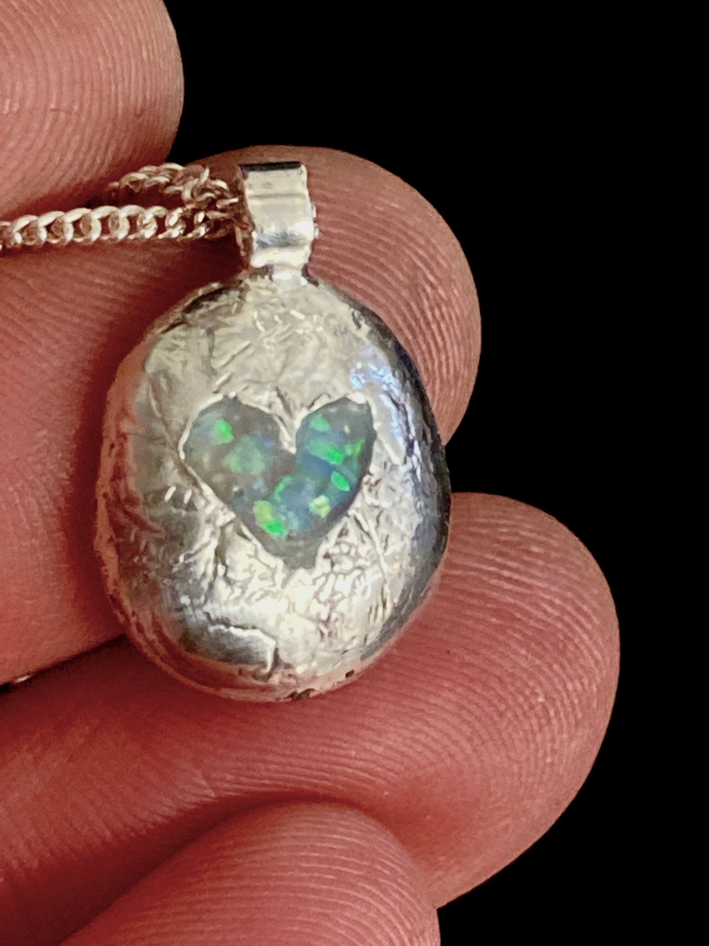Silver pebble with heart and opal inlay