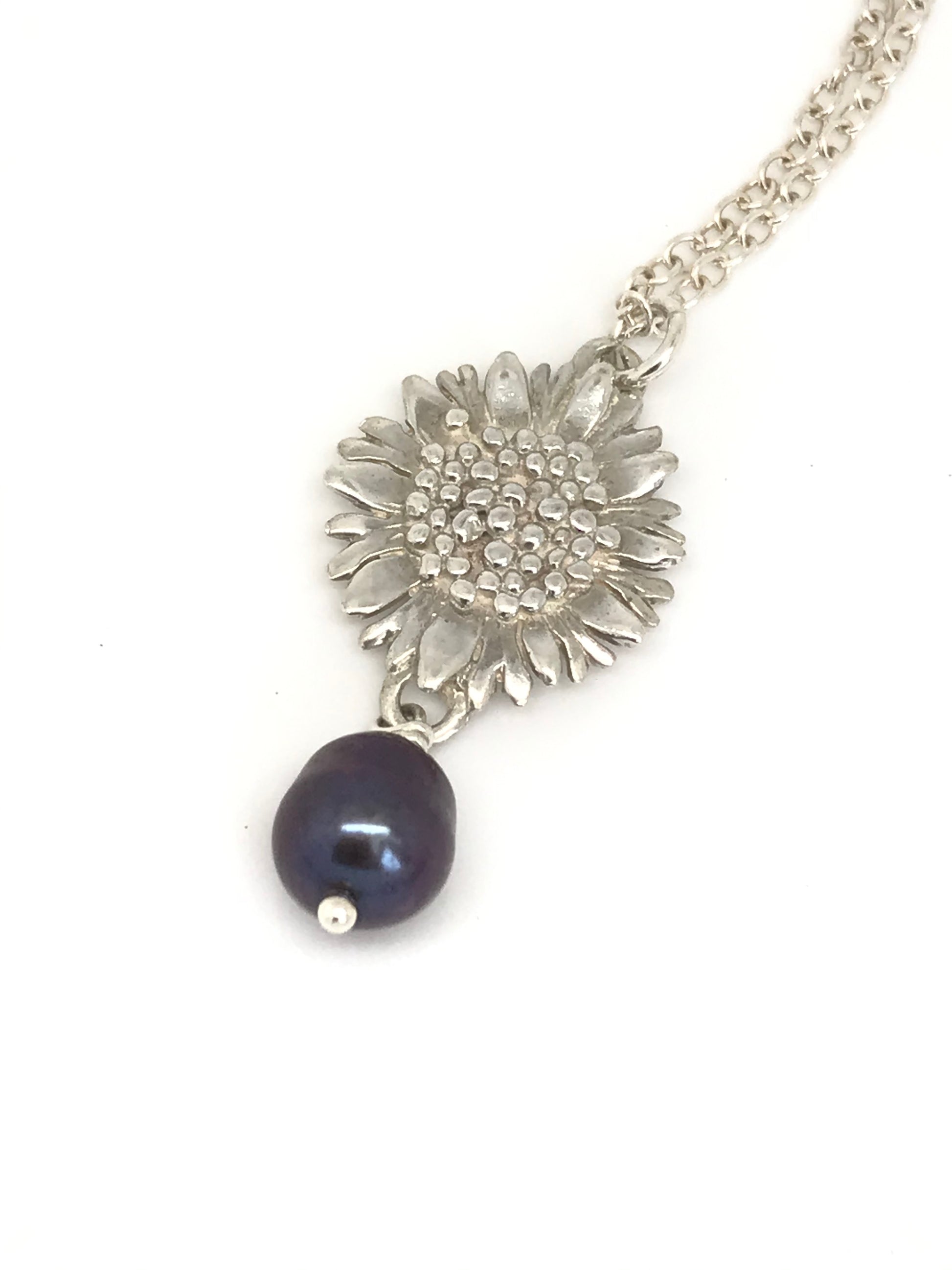 Silver sunflower with black pearl
