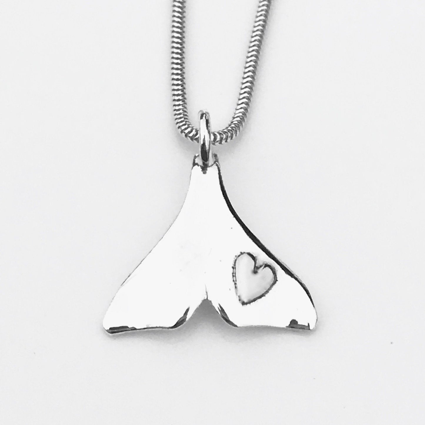 Dolphin tail necklace with heart