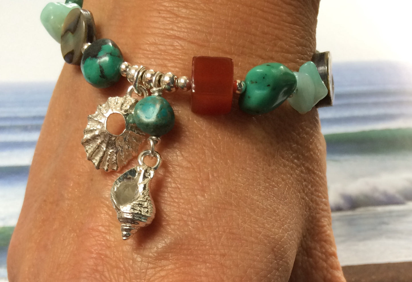 Silver sea shell bracelet with turquoise beads
