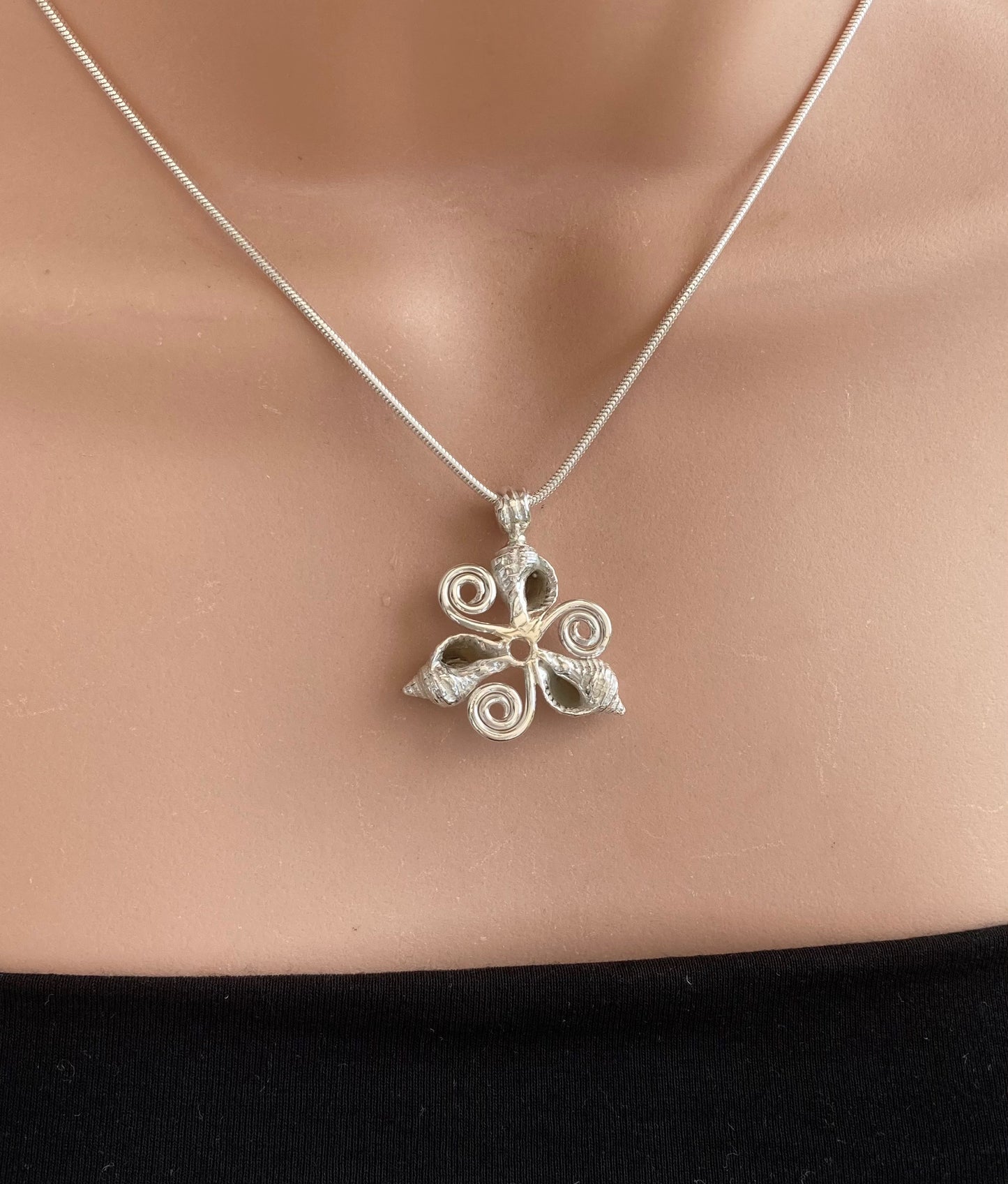 Whelk shells triskelion necklace
