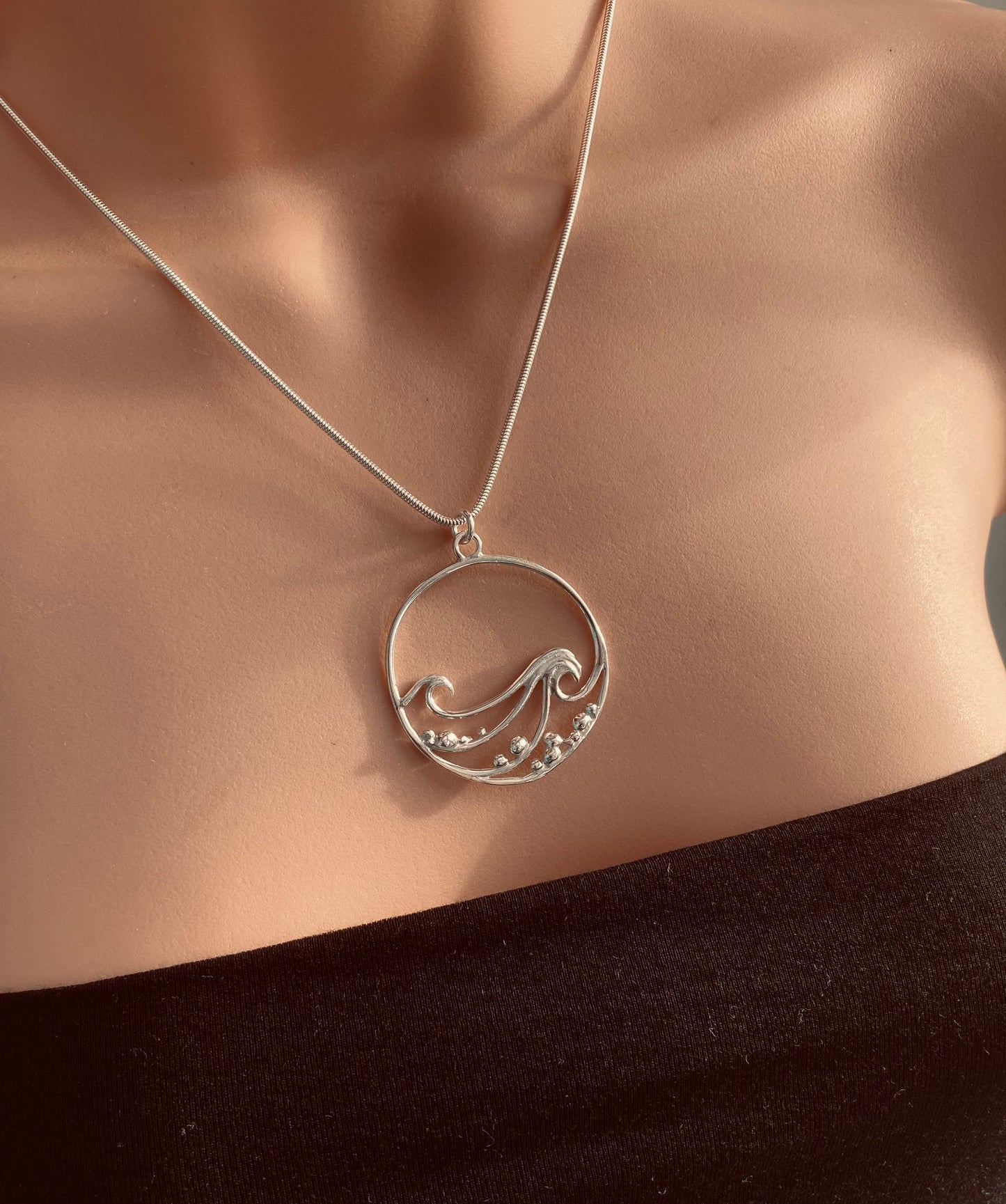 Wave and pebbles necklace