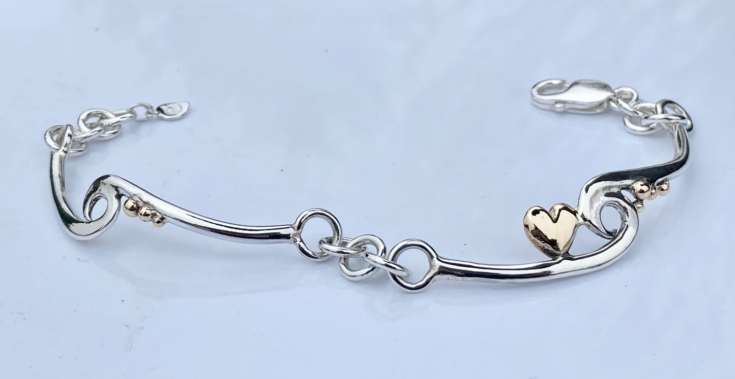 Wave silver bracelet with gold heart and pebbles