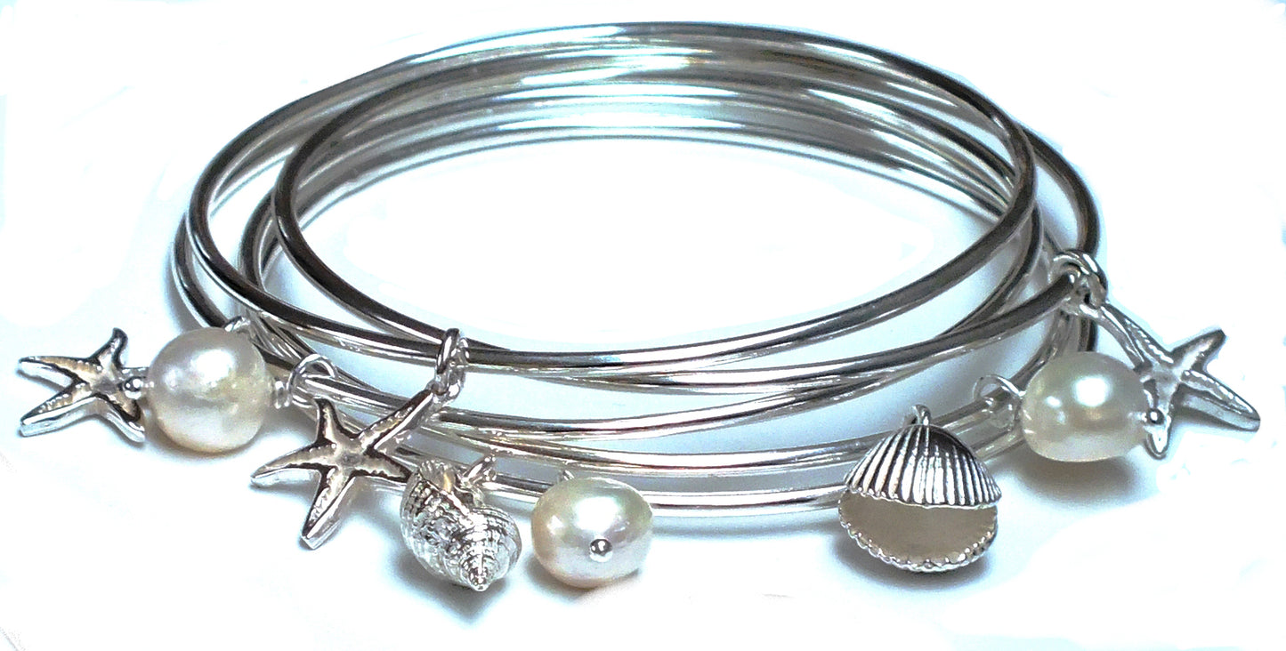 Starfish, cockle shell and whelk shell bangles.