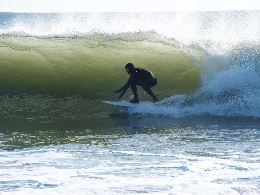 Evan Davies surfing Gower