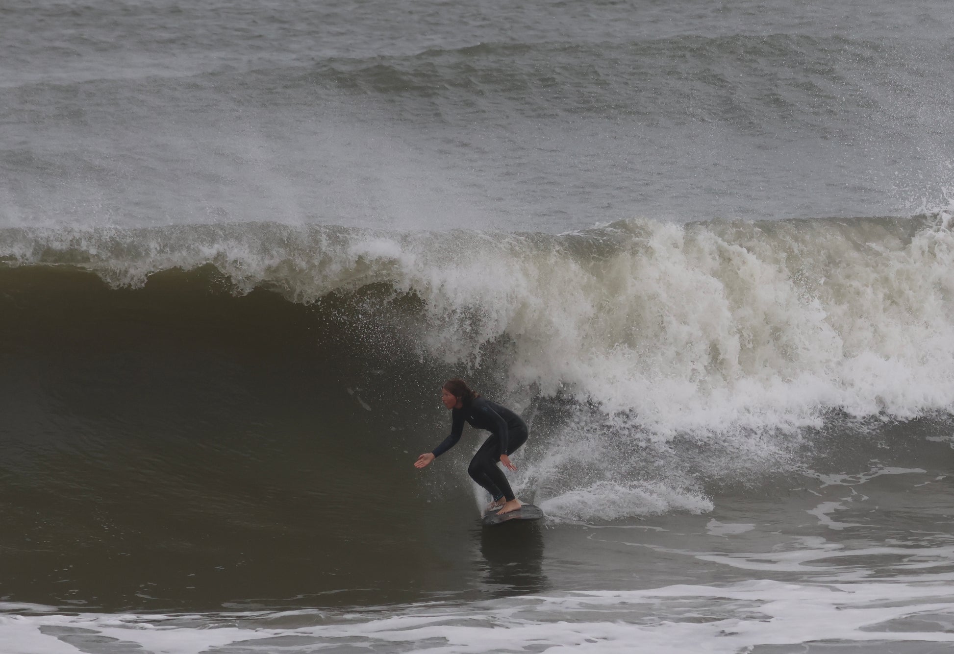 Pa-pa girl surfing waves in Gower wales 