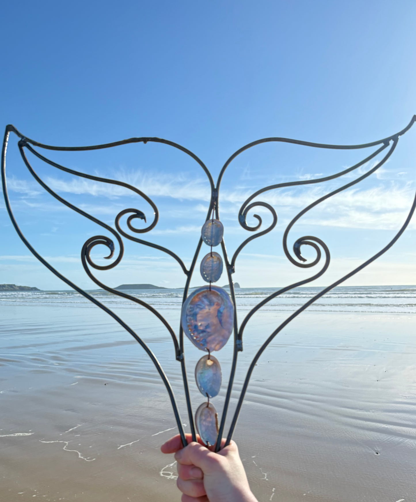 Whale tail metal wall sculpture 