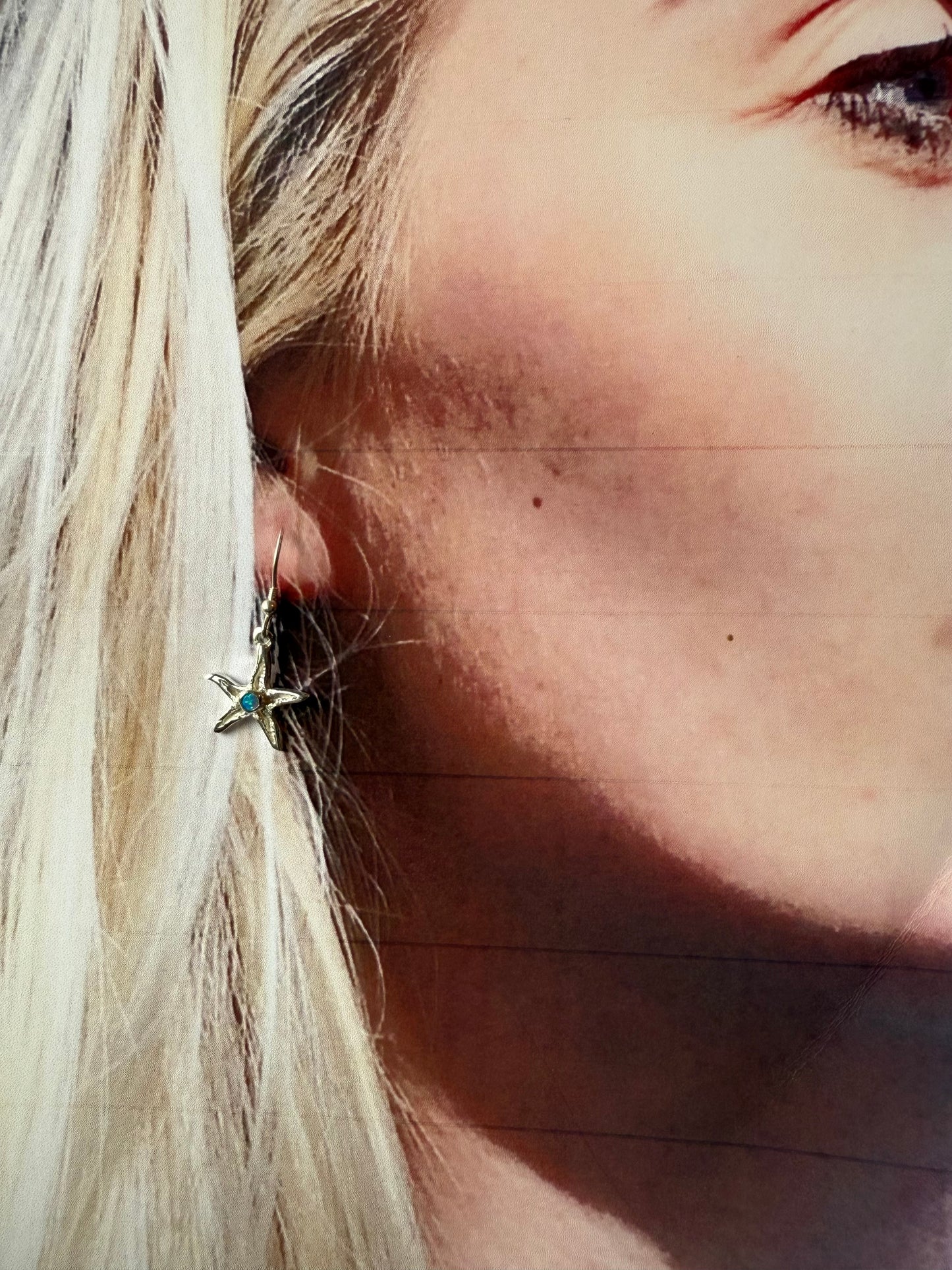 Silver starfish drop earrings with opal
