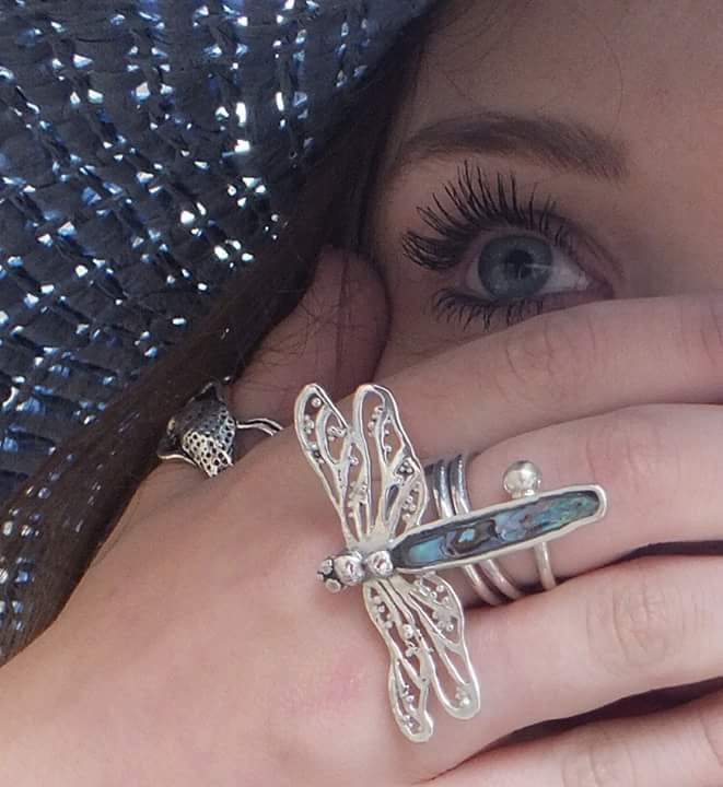 dragonfly ring designer worn on a models hand 