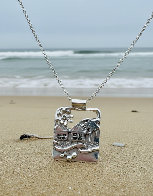 Silver pendant  a Langland Bay seascape beach scene with flower huts and waves in solid silver