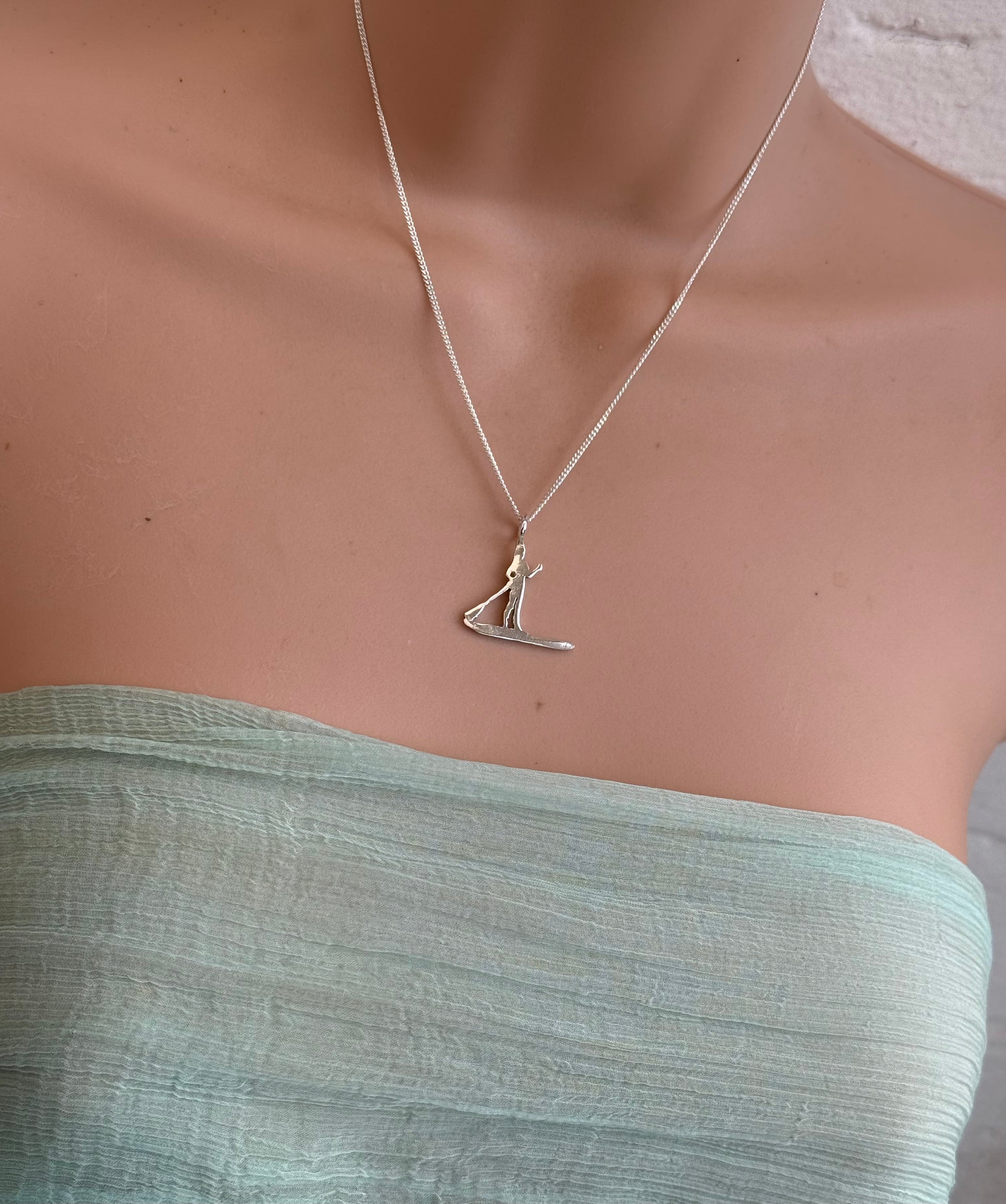 Stand up paddle boarder surfer necklace in silver on a chain 