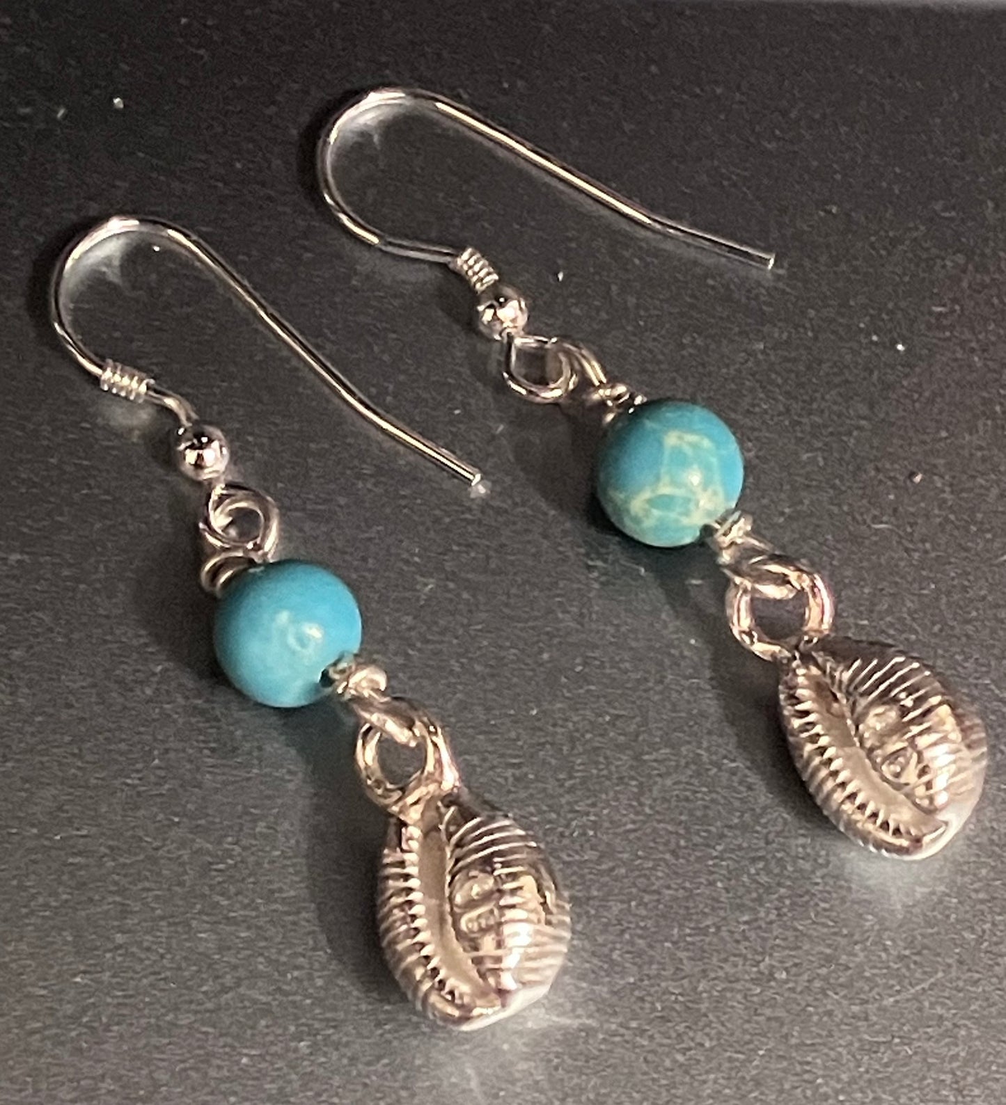 cowrie shell earrings with turquoise coloured bead 