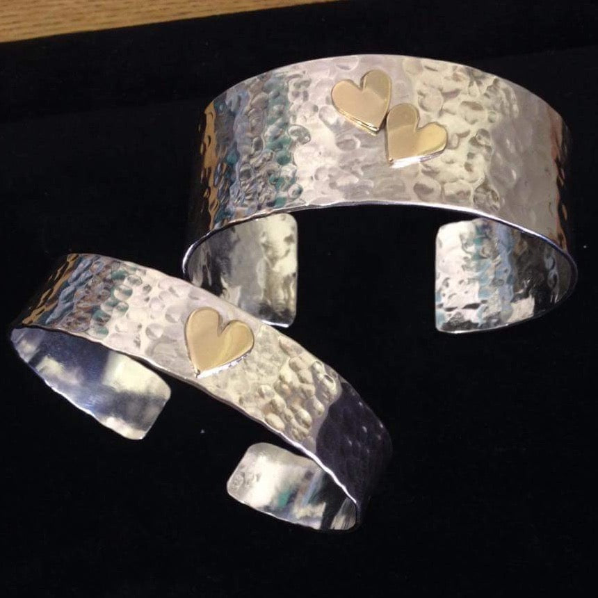 Silver textured cuff with gold hearts