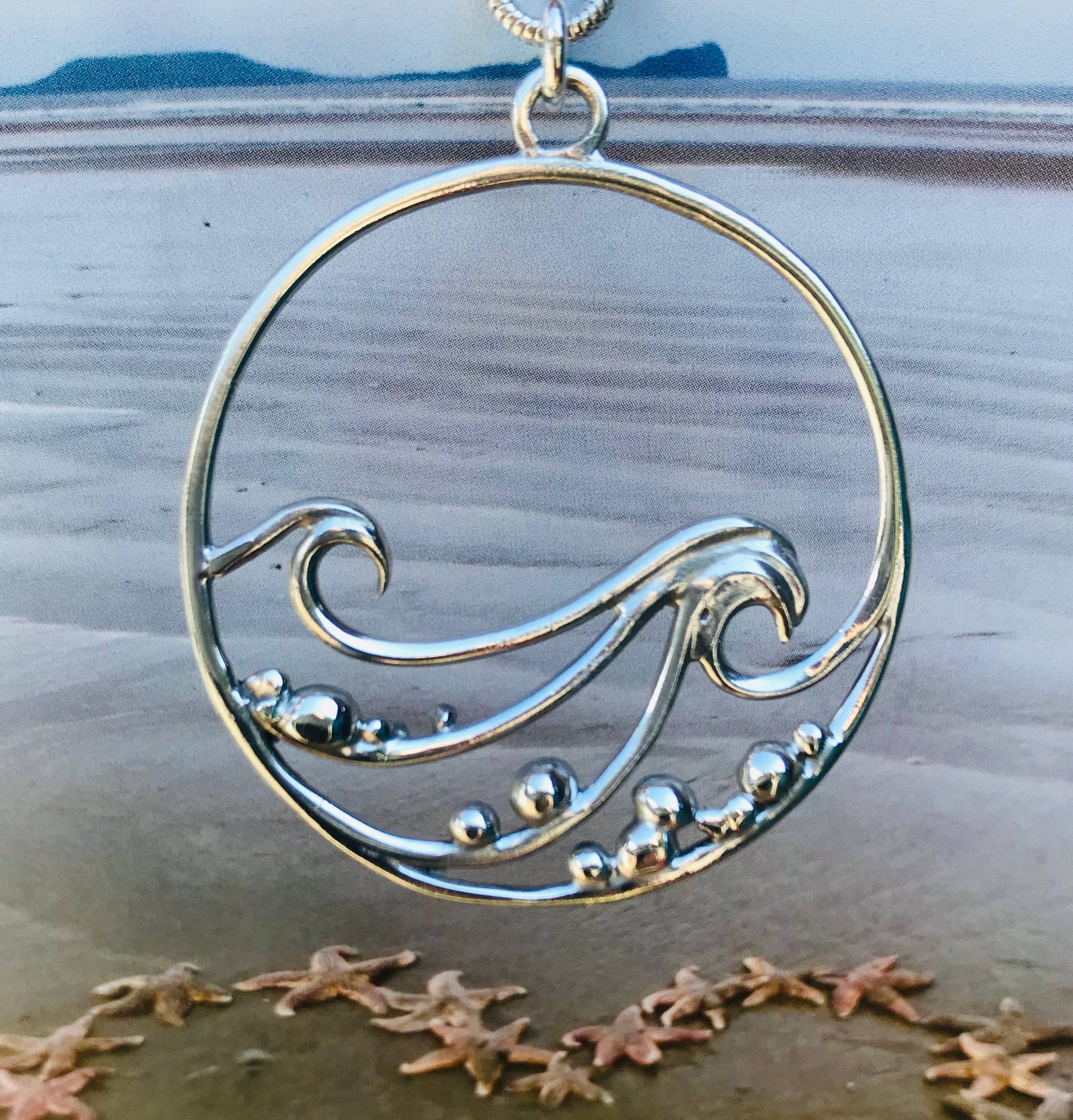 Wave and pebbles necklace
