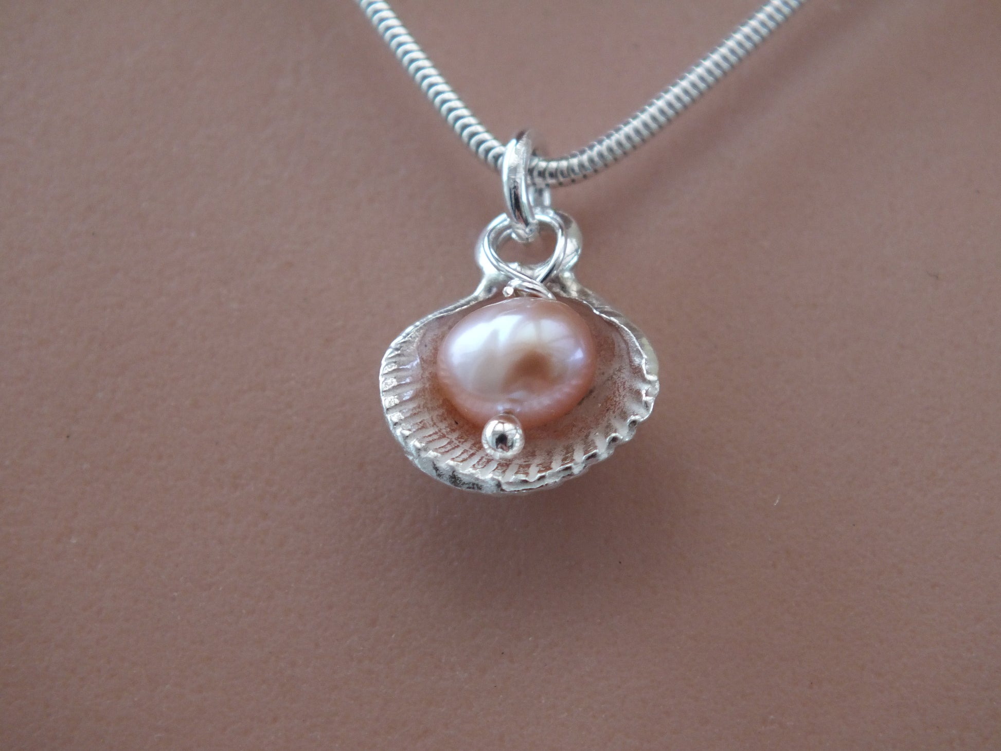 cockle shell solid silver necklace with pearl earl inside necklace