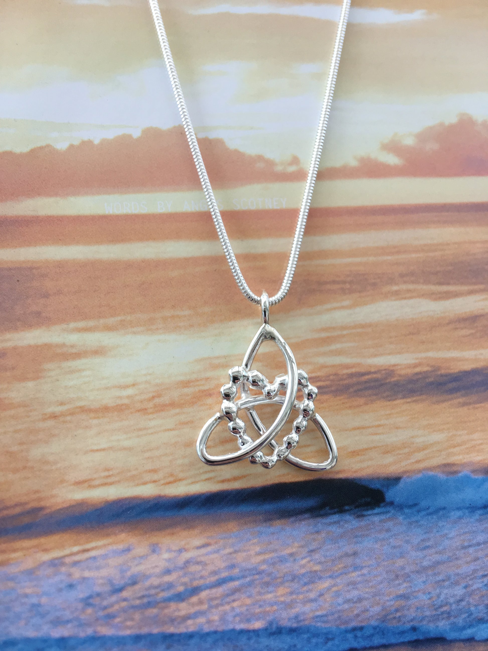 Silver triquetra with pebble heart