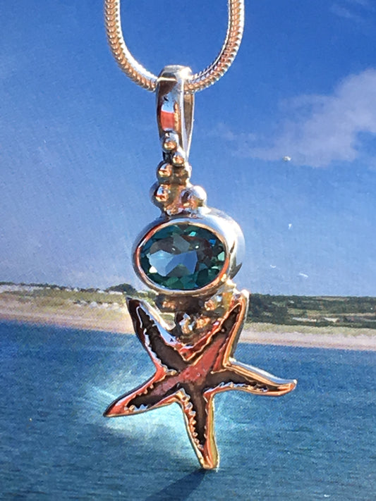 Silver starfish topaz necklace