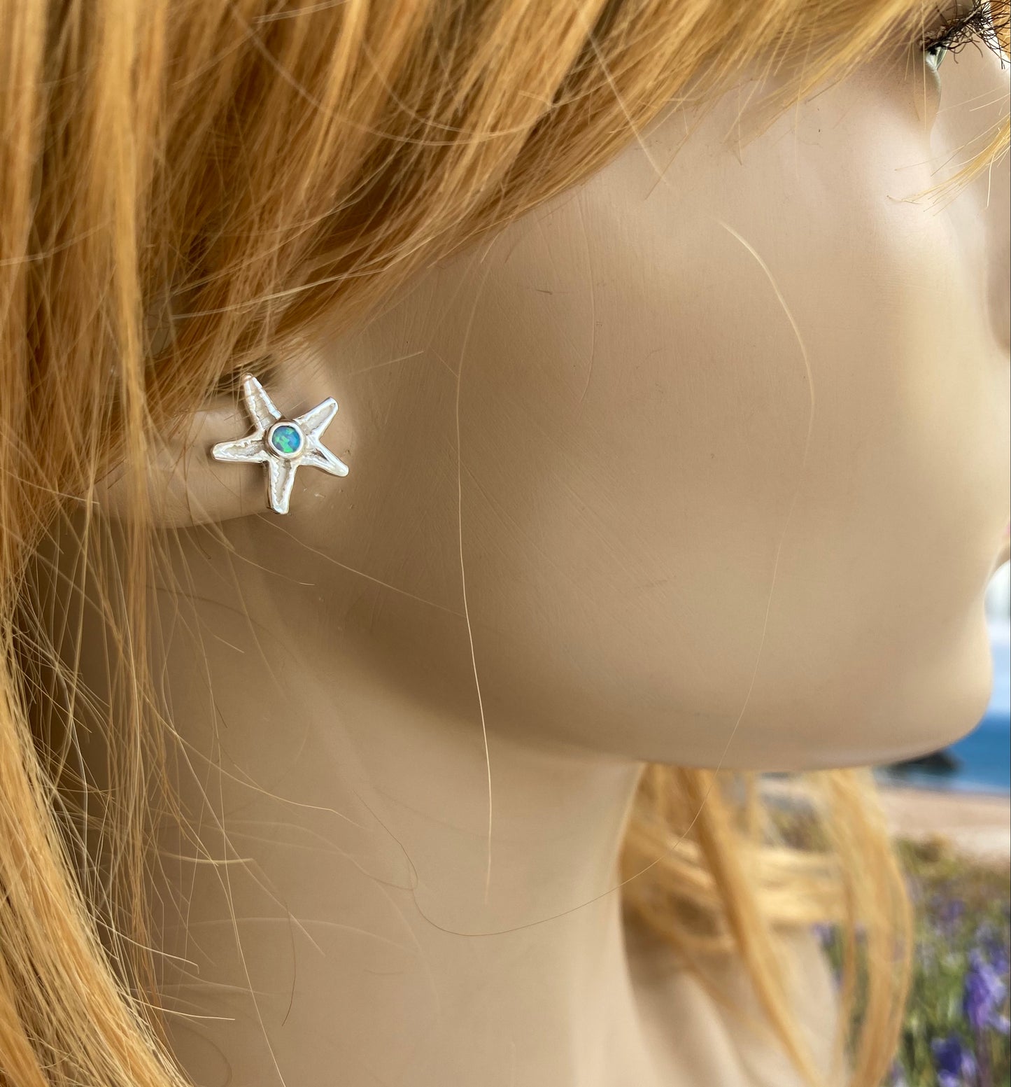 Silver starfish stud earrings with opal