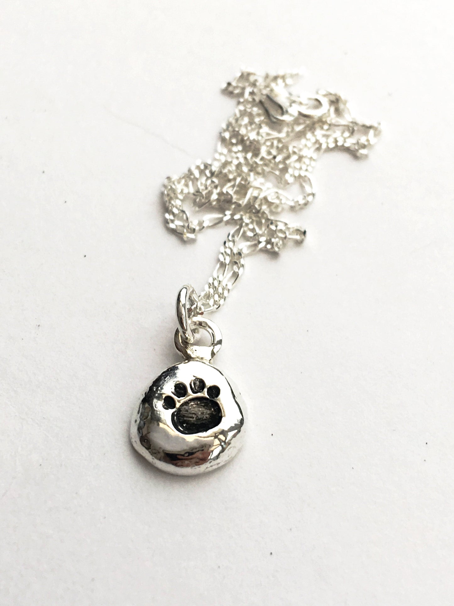 Paw stamped pebble necklace