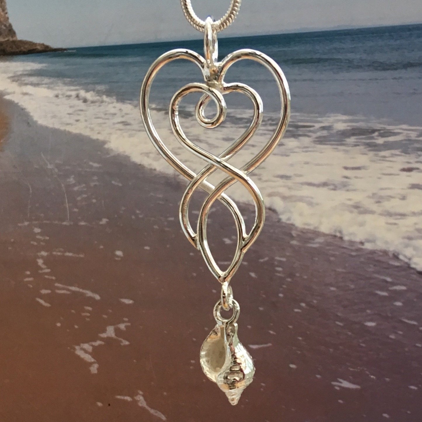Celtic whelk shell heart necklace