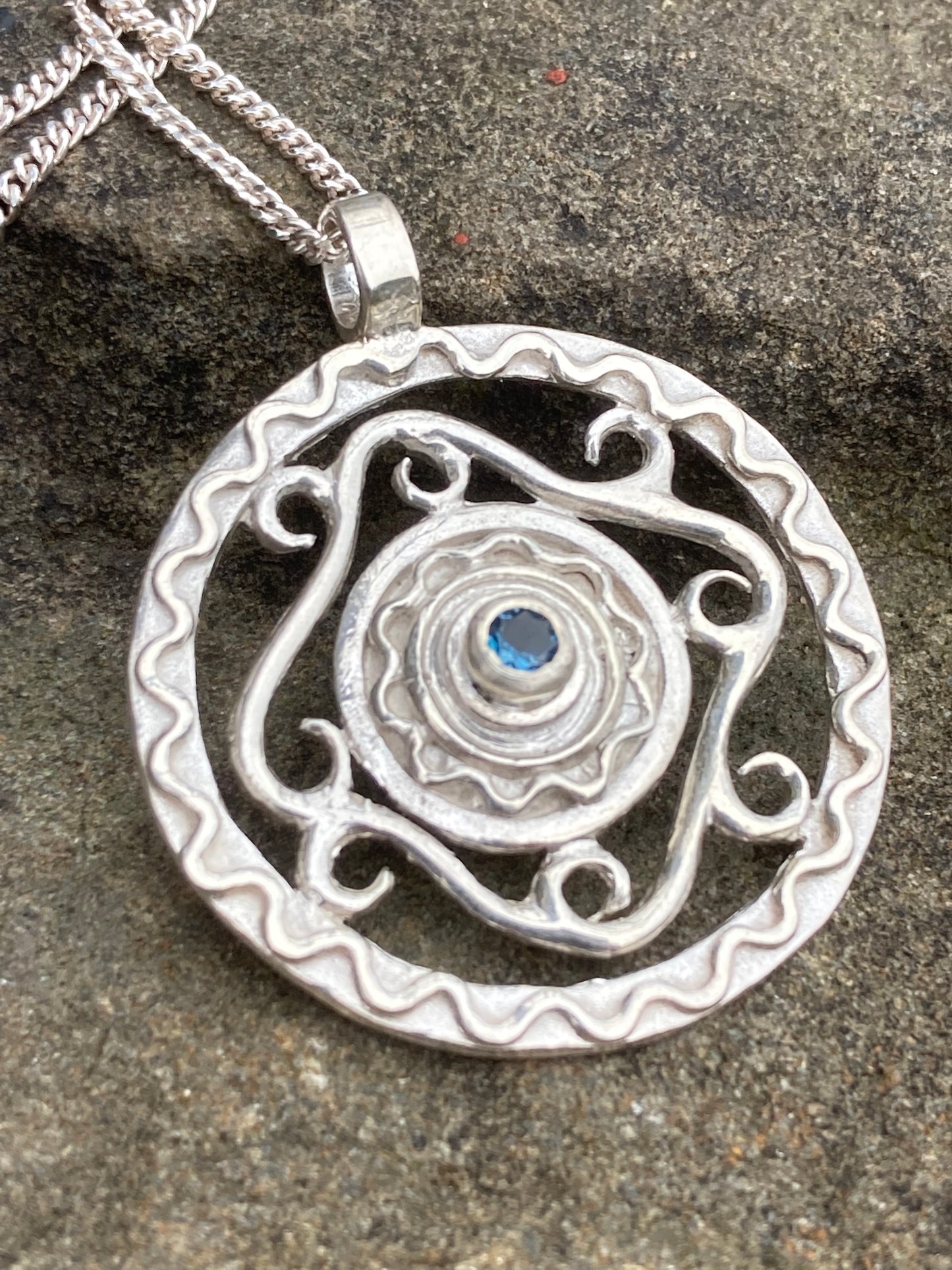 Silver pendant with chain and blue sapphire
