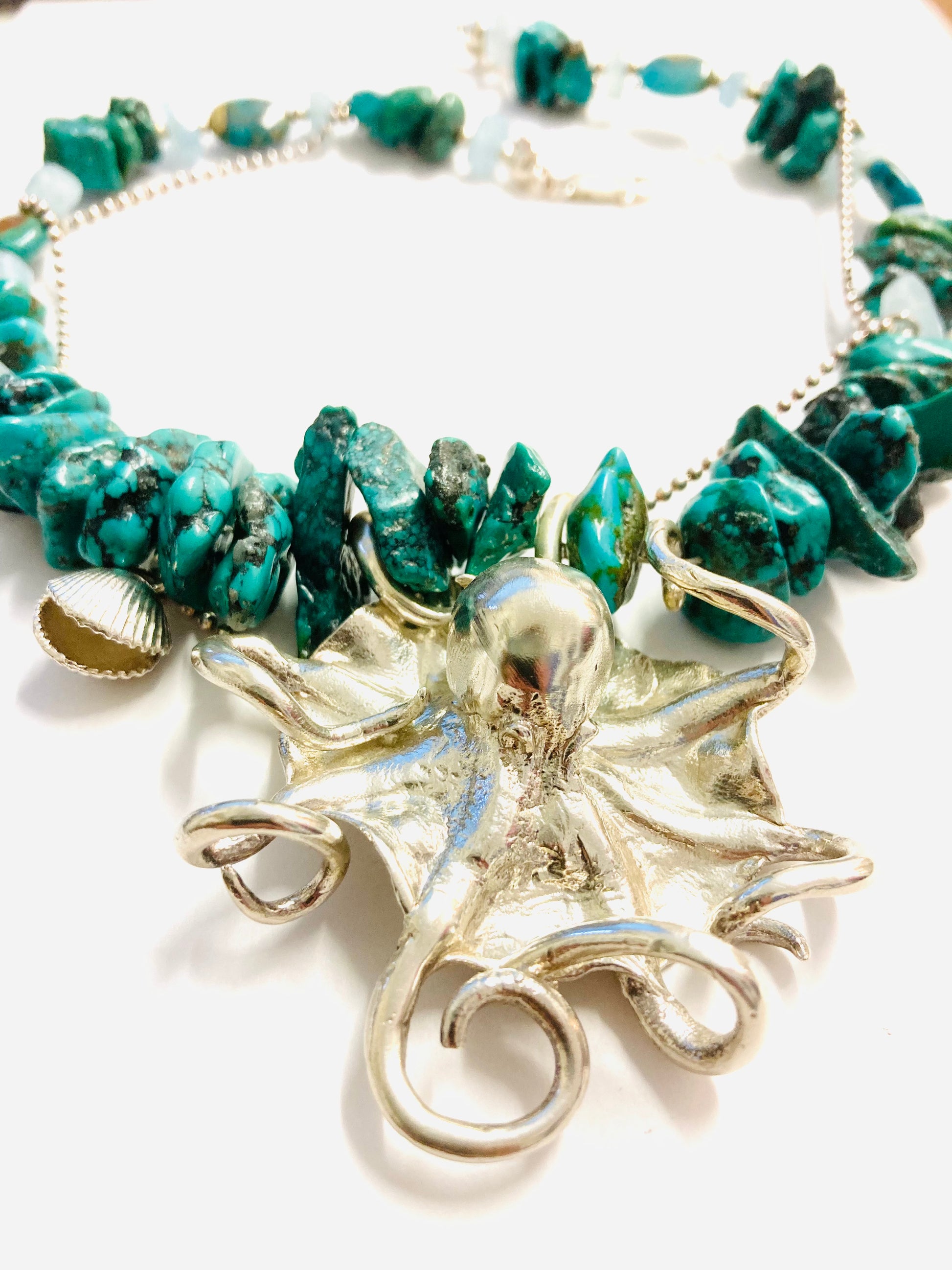 Large octopus with turquoise beads and cockle 