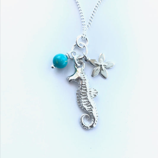 Silver seahorse necklace and starflower