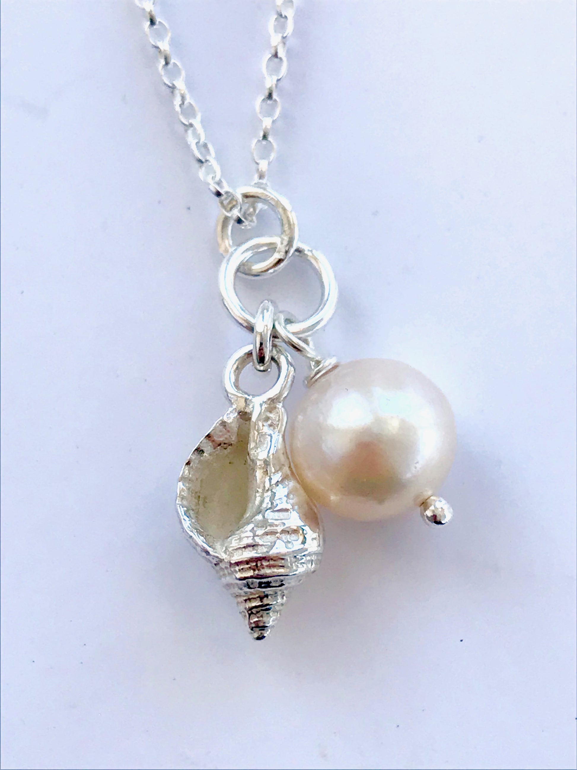 Whelk shell and white pearl necklace