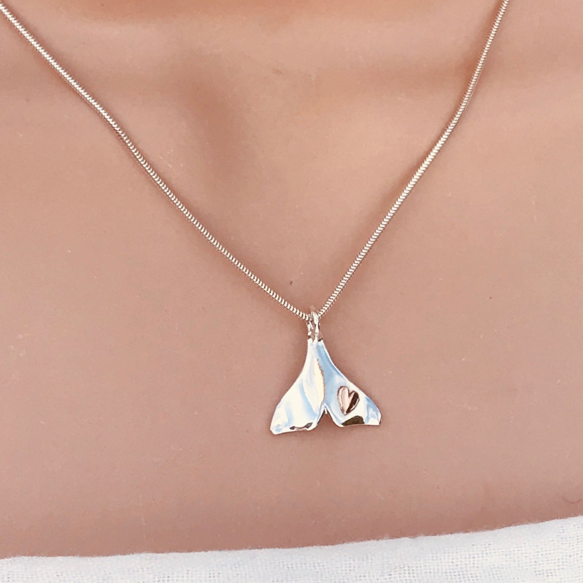 Dolphin tail necklace with heart