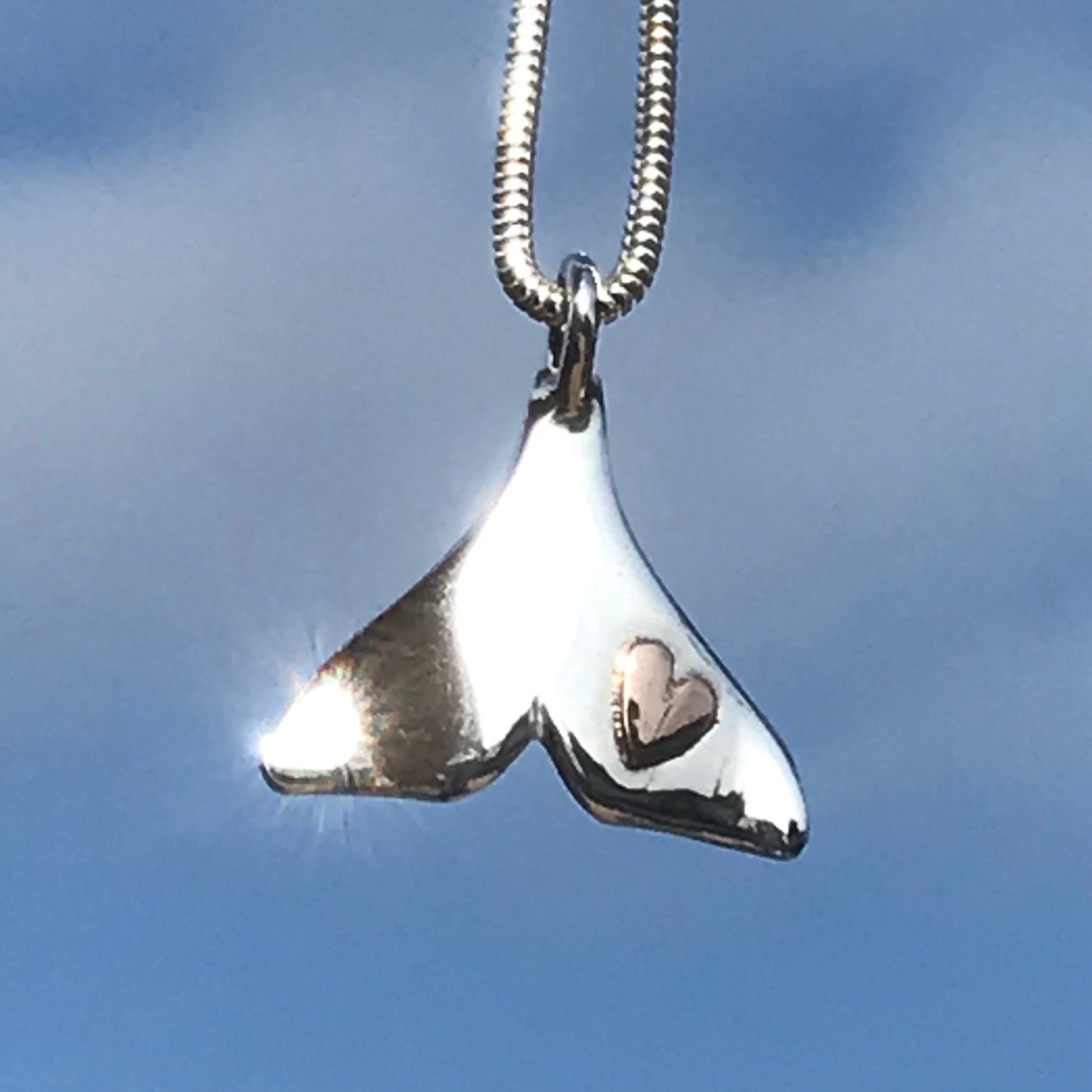 Dolphin tail necklace with heart
