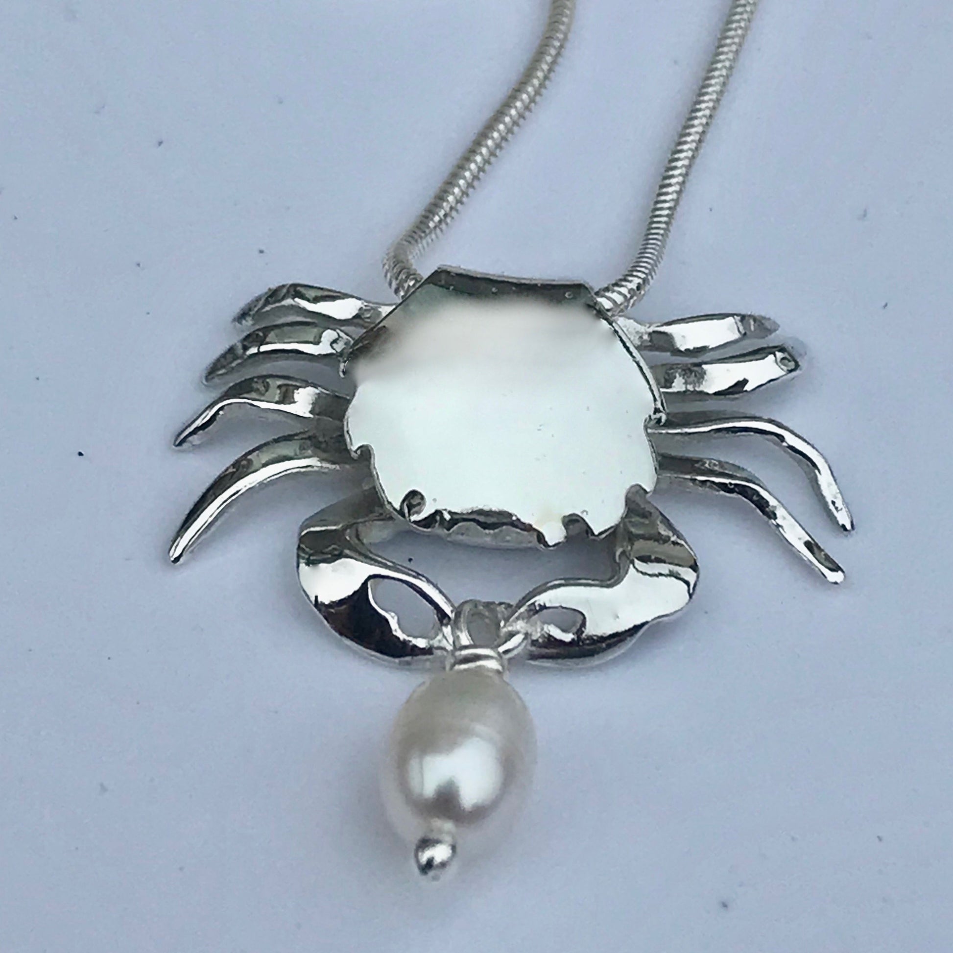 Silver crab and white pearl