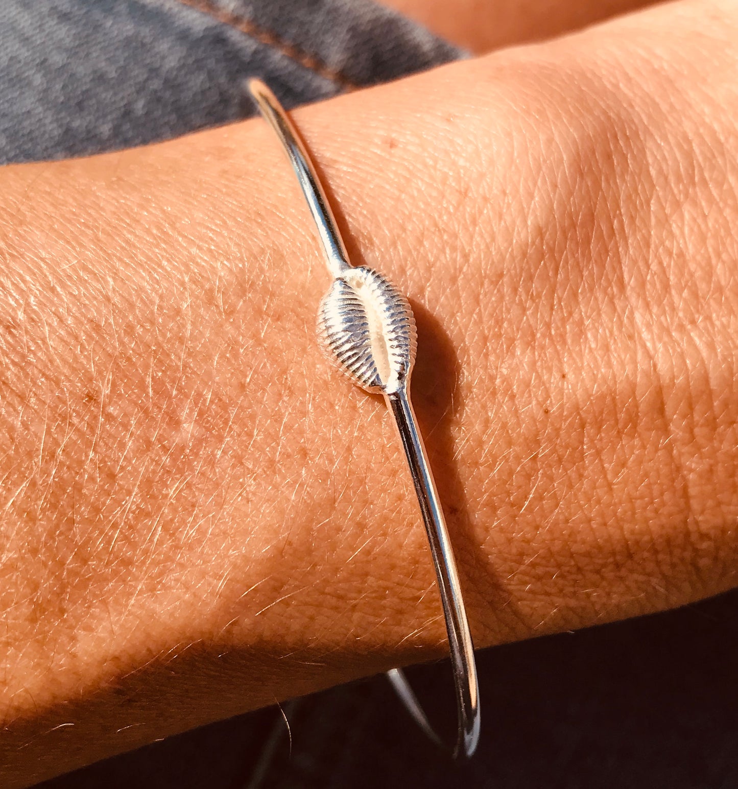 Silver cowrie shell bangle