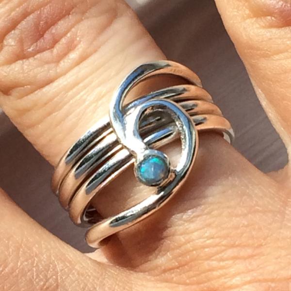 Silver barrelling wave and opal ring