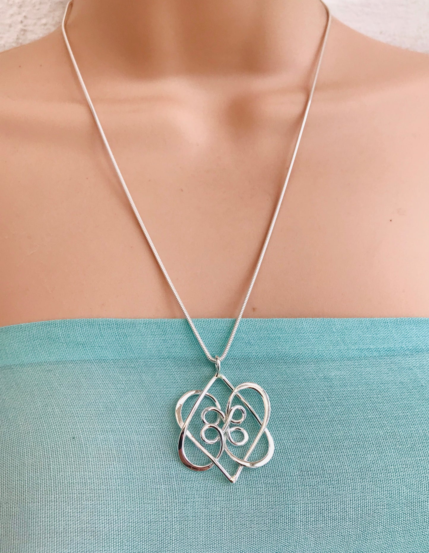 Celtic double heart knot pendant