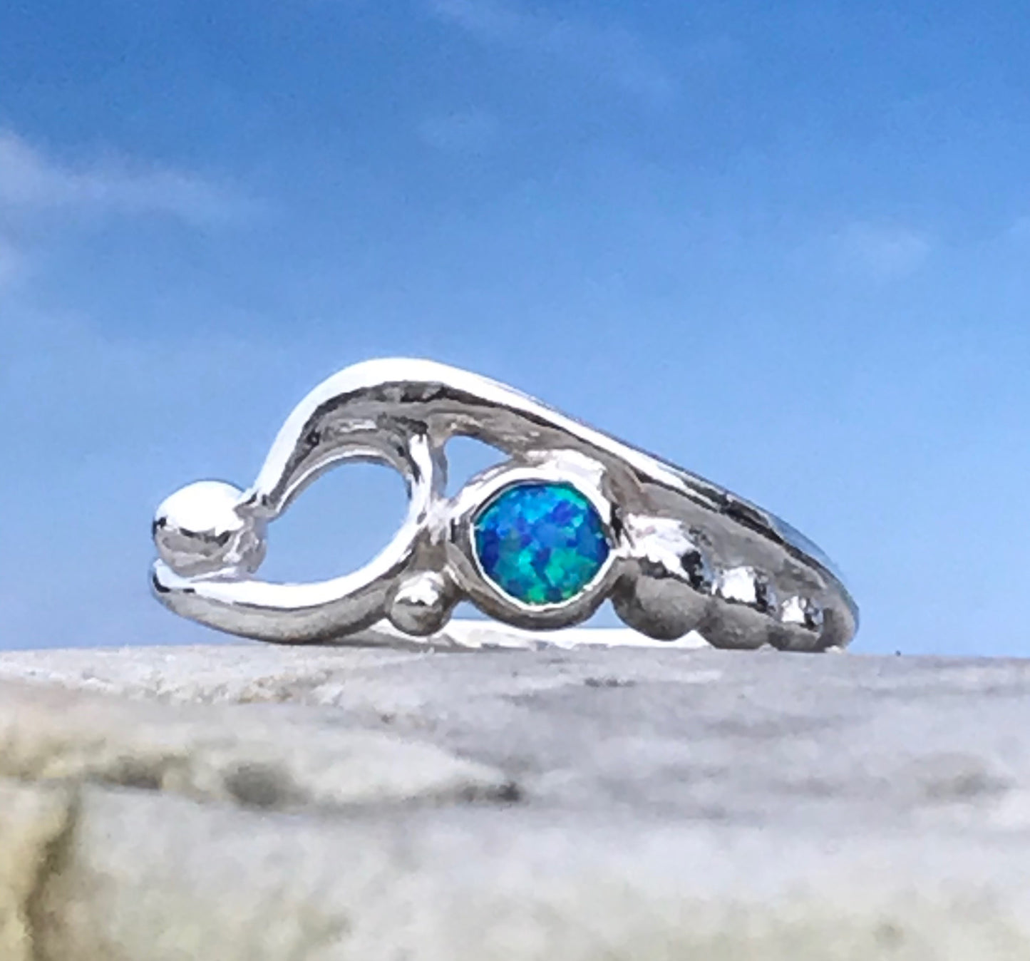 wave and pebbles ring with manmade opal