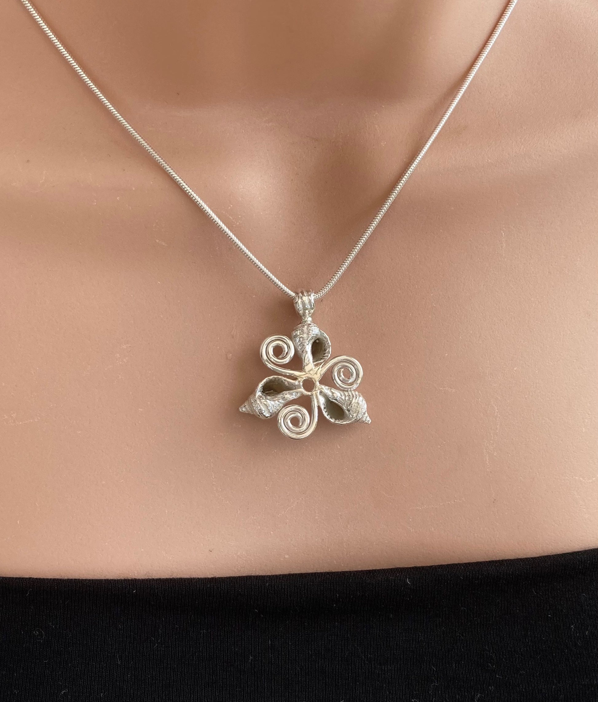 Whelk shells triskelion necklace