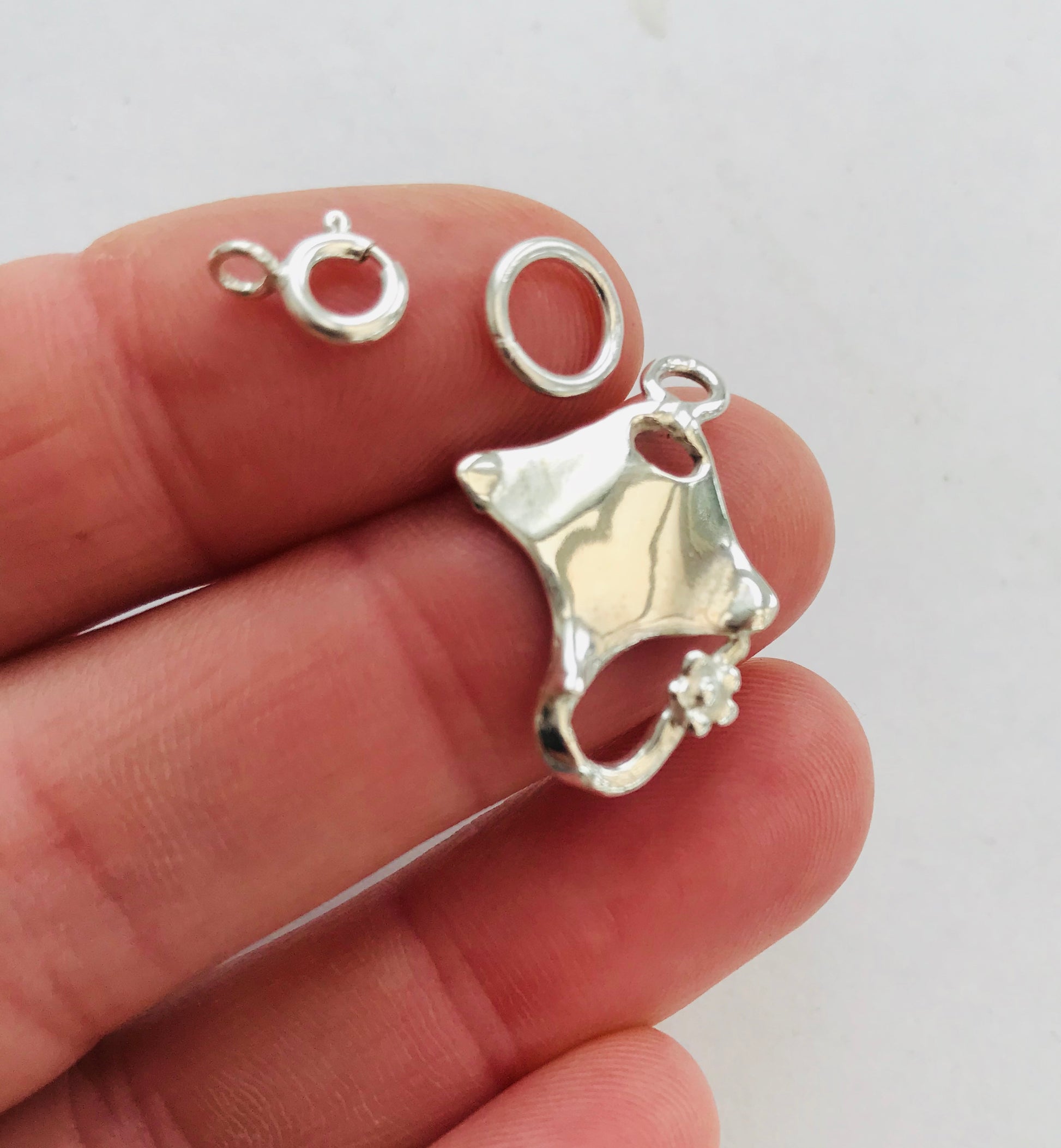 Silver baby manta ray necklace