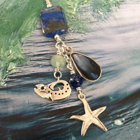 This is a unique solid silver starfish, baby real set blue mussel and baby bass necklace.