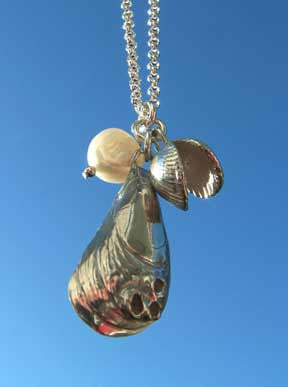 This is a unique solid silver mussel and cockle shell necklace